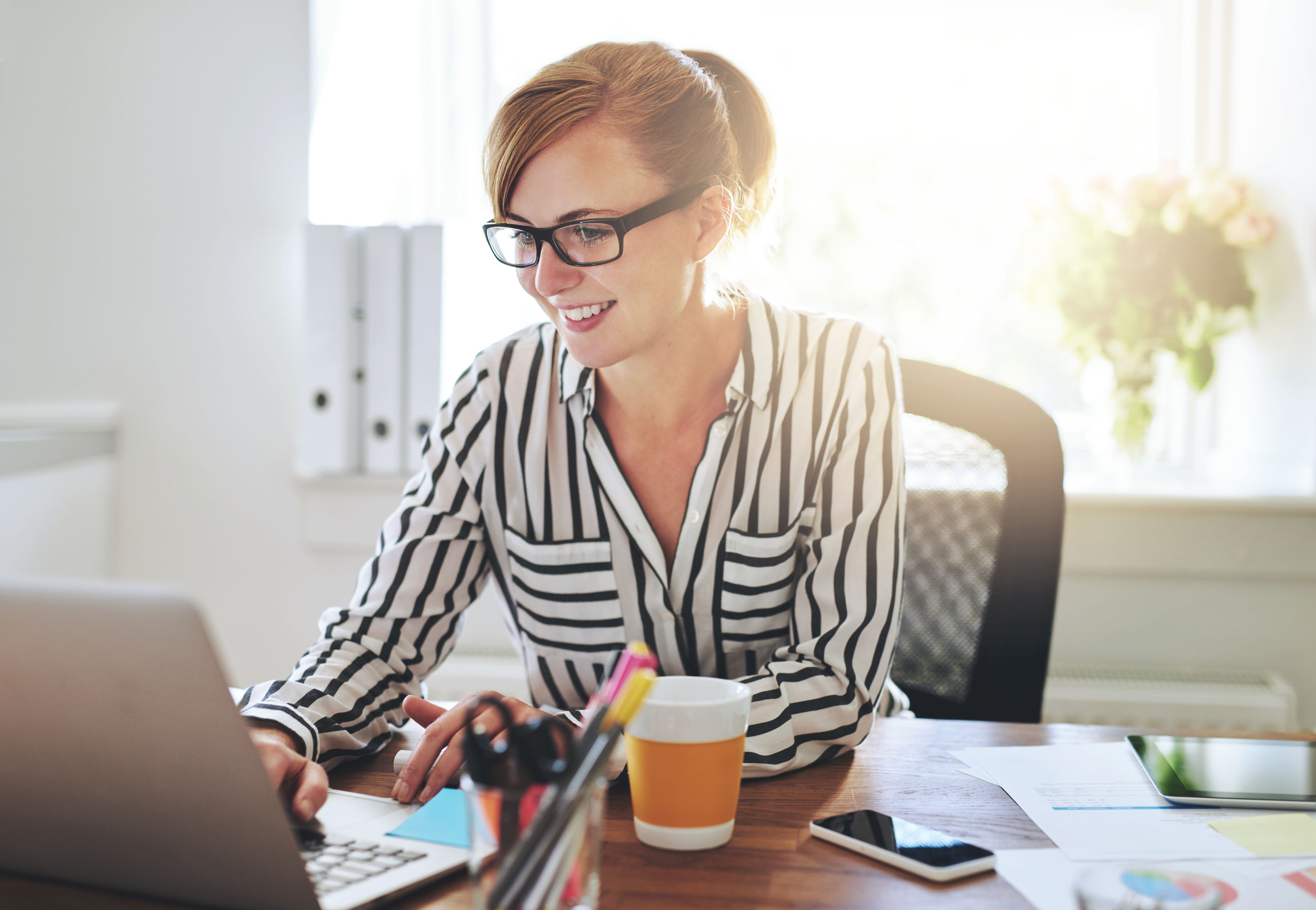 Person creating rental document on computer.